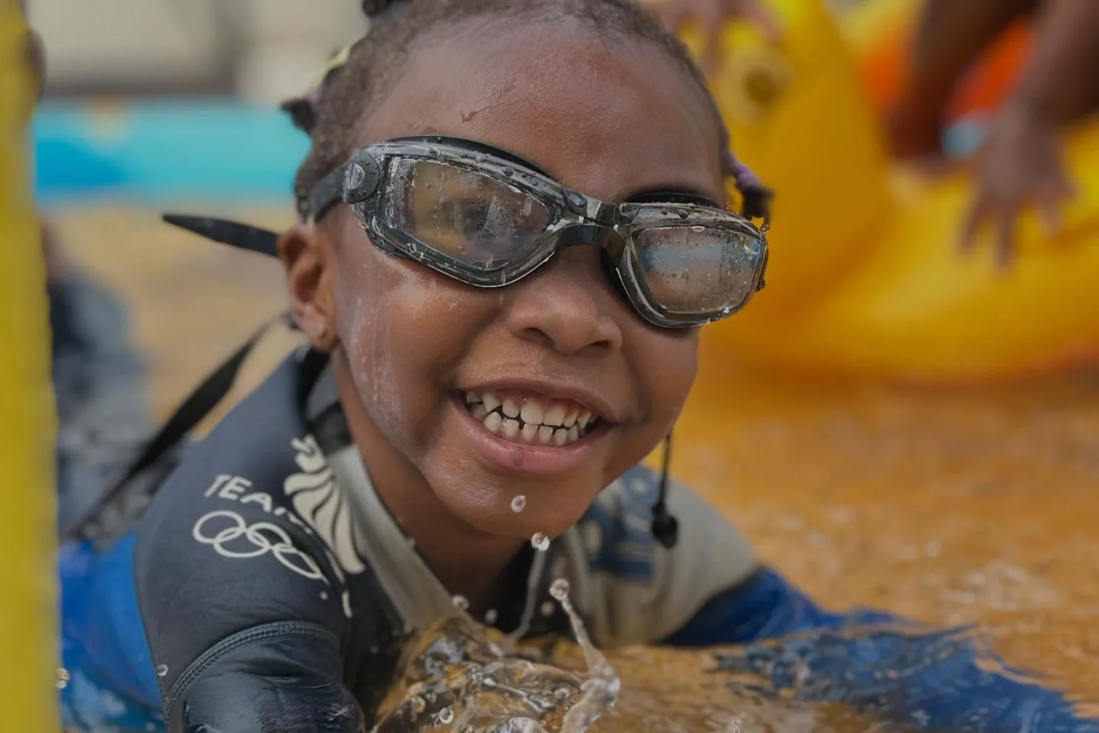 A student swimming during a school activity.